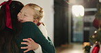 Christmas, hug or love with mother and daughter in living room of home for festive celebration. December, smile or winter with girl child and single parent woman embracing in apartment for holidays