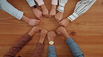 Circle, group or hands of people with fist bump for team building, office community or solidarity. Above, mission and employees at work for company unity, cooperation and business support in meeting