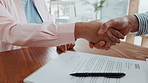 Business people, contract and signature with handshake for legal agreement, deal or job application. Closeup, employees or shaking hands with form or signing for hiring, recruiting or b2b partnership