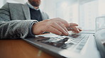 Closeup, businessman and hands typing on laptop for account management or finance report. Low angle, keyboard or accountant with technology for taxes compliance, investment project or auditing budget