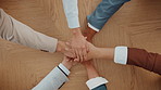 Stack of hands, collaboration and business people in office with solidarity, unity or team building. Top view, group and corporate employees with bonding, huddle or trust for project in workplace.