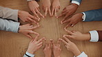 Business people, hands and star in circle for teamwork, collaboration or synergy at table. Above, group or together in office with gesture, solidarity or workforce integration for company cooperation