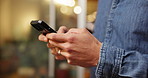 Person, hands and typing with phone for research, social media or communication in home. Closeup, texting or user browsing with mobile smartphone or technology for connection, network or app in house