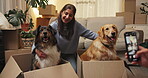 Happy, woman and picture of dogs, moving or memory of domestic animals in box, couple or relocation. Photography, online and people with pet in new home, bonding or post for milestone on social media