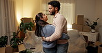 Moving in, happy and couple with dancing in new house for investment success, relocation and night. Evening, people and celebration in first home for mortgage security, goals and real estate purchase