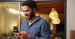 Phone, smile and man in home at night for message, internet notification or laugh at funny text. Mobile, person and communication for social media, typing and download app for online meme with bokeh