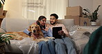 Tablet, dogs and happy couple in new home to search for renovation idea, app or moving checklist. Man, woman and pets on sofa with technology for planning, relocation and laugh for funny joke