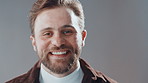 Face, business and man in studio, smile and funny with creative agency on gray background. Portrait, person and model with happiness, entrepreneur and success with startup, space and career ambition