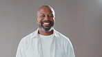 Face, creative and laugh with black man in studio as comedy screenwriter, script author and career pride. Portrait, mature director and about us for humor, funny joke and good mood on gray background