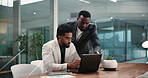 Men, discussion and laptop at office with financial review, point and insight with revenue data. Business people, happy and conversation with computer, team and collaboration for solution at agency
