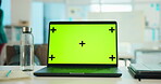Laptop, green screen and mockup in office for marketing website on desk with tracking markers. Computer, workspace and display for advertising, business and monitor for software design on internet
