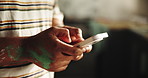 Painting, home and hands of man with phone for diy inspiration, renovation ideas or planning. Interior design, remodeling and person on smartphone for internet, website or app for creative project