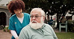 Nurse, walking or old man with wheelchair in garden for medical support, fresh air or talking. Healthcare, caregiver or senior person with disability for rehabilitation or kindness at retirement home