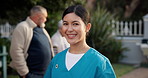 Happy woman, face or nurse at retirement home for assisted living or healthcare service. Portrait, female person or caregiver with smile in backyard at nursing house for pension, help or elderly care