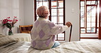 Home, thinking and old woman with retirement, walking stick and memory with dementia. Bedroom, pensioner and elderly person with disability, cane and depression with wellness, decision and alzheimer