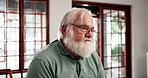 Alone, depression and sad with senior man in retirement home for memories or nostalgia. Relax, regret and thinking with unhappy elderly person in apartment for contemplation or mental health