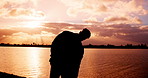 Person, stretching and fitness with silhouette, lake and warm up at sunrise for training routine. Athlete, runner and outdoor by water with back, view and mindset for workout, exercise or wellness