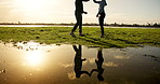 People, fitness or high five with reflection in nature for success, achievement or workout together. Man, woman or active friends with touch by river, ocean or pond for exercise or physical training 