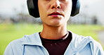 Breathe, fitness and woman with headphones in park for running, marathon training and exercise. Sports, outdoor and person with music rest for fatigue, tired and break for workout, challenge or race