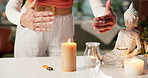 Candle, meditation and hands of woman in home with zen, calm or peace for chakra energy. Flame, spiritual health and female person with ritual for aura balance, wellness or relax in apartment.