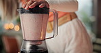 Blender, smoothie and hands of woman in home for health, diet and detox with vitamin benefits. Kitchen, morning and person with drink, fruit shake and juice for protein, nutrition and digestion