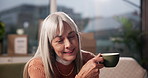 Mature woman, coffee cup and laptop in home with typing, smile and sales with dropshipping on sofa. Person, tea and drink with computer, ecommerce or remote work on couch for small business at house