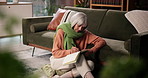 Senior woman, writing and notebook in house for planning, self reflection and reminder of tasks. Elderly person, relax and journal for agenda checklist, personal message and notes of retirement goals