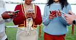 Hands, phone and social media with friends outdoor together for connectivity or networking. App, text message and typing with group of people in nature for contact, information or internet search