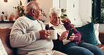 Coffee, phone and elderly couple in home for relax, conversation and laugh together with embrace. Tea, man and woman in retirement with mobile for news, puzzle app or funny meme with joke on internet