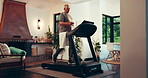 Fitness, treadmill and walking with senior man in living room of home for health or wellness. Exercise, physiotherapy and rehabilitation with old person in apartment for cardio training or workout