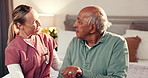 Healthcare, hug and nurse with senior man in home for consultation with good news for treatment. Medical checkup, conversation and caregiver embracing male patient in bedroom for healing in house.