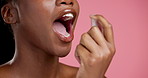 Dental, spray and mouth of black woman in studio for oral hygiene, fresh breath and self care.  Fluoride treatment, gum disease mist and cleaning with closeup of person and product on pink background