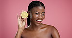 Skincare, lemon and face of black woman in studio with hydration, glow or treatment. Beauty, smile and portrait of African female person with citrus fruit for facial dermatology by pink background.