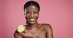 Skincare, happy and black woman in studio with lemon for face hydration, glow or treatment. Beauty, portrait and African female person with citrus fruit for facial dermatology by pink background.
