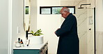 Senior man, gown and bathroom at house for wake up, getting ready and morning routine. Elderly male person, mirror and tying robe to start day for weekend break, stress relief and feeling fresh