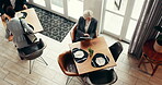 Browsing, tablet and woman in restaurant, waiting or planning for meeting with digital notes on web. Above, lawyer and mature person with tech for legal records, info or preparation for case in diner