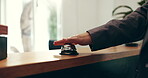 Secretary, customer and hands on bell at hotel reception as guest for help, answer and hospitality. People, arrival and ring at front desk of resort for accommodation, client booking or reservation