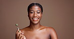 Smooth, skin and woman with jade roller, face or facial treatment for skincare, anti aging or pride. Mockup space, black person and routine with cosmetic tool for glow, studio background and wellness