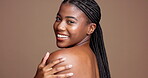 Shoulder, body care and smile with face of black woman in studio for skincare, beauty and hygiene. Glow, dermatology and shine with female model on brown background for mockup space and grooming