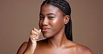 Woman, brushing teeth and face in studio for smile, clean mouth and oral care on background. African girl, portrait and bamboo toothbrush for dental wellness, space and plaque removal in Nigeria