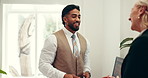 Hotel, hospitality and receptionist with guest at front desk for welcome, check in or reservation. Friendly service, woman and concierge with computer screen for room upgrade request or accommodation