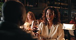 Date, laughing and toast with couple in restaurant at night for anniversary, bonding or celebration. Cheers, fine dining and wine with funny people drinking alcohol at table for evening conversation