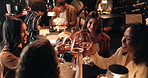 Girls night, laughing and toast with friends in restaurant for bonding, reunion or social gathering. Cheers, fine dining and wine with group of people at table together for evening catch up or drinks