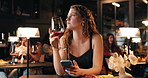 Waiting, wine and woman with phone in restaurant for date with text message, check time and cancel. Sad, diner and person with alcohol drink on smartphone for communication, online chat and meeting