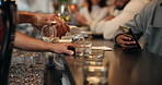 Restaurant, pour and hands of waiter with glass for serving customers, order and hospitality. Diner, counter and person with alcohol, drink and beverage for service, cocktail and working at hotel