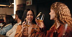 Women, friends and toast at bar with wine, social gathering or reunion with smile at restaurant. Girl, group and happy hour for talk, celebration drinks and bonding with chat on night out at pub