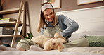Girl, play and puppy on bed for love, care and bonding with comfort, smile and pet animals at apartment. Woman, dog mom and happy with golden retriever for touch, stroke or relax in bedroom at house