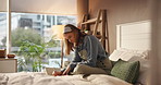Ideas, planning and writing with woman in bedroom home for literature, publication or storytelling notes. Hobby, notebook and pen with writer person on bed in apartment as author of fiction novel