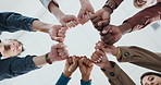 Fist bump, below and hands of business people in office for teamwork, collaboration and support. Professional, startup company and workers in circle for solidarity, cooperation and partnership