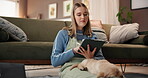 Woman, designer and drawing with tablet, dog or puppy in home for remote work or design. Female person, pet owner or freelancer writing with technology for sketching or online creativity in house